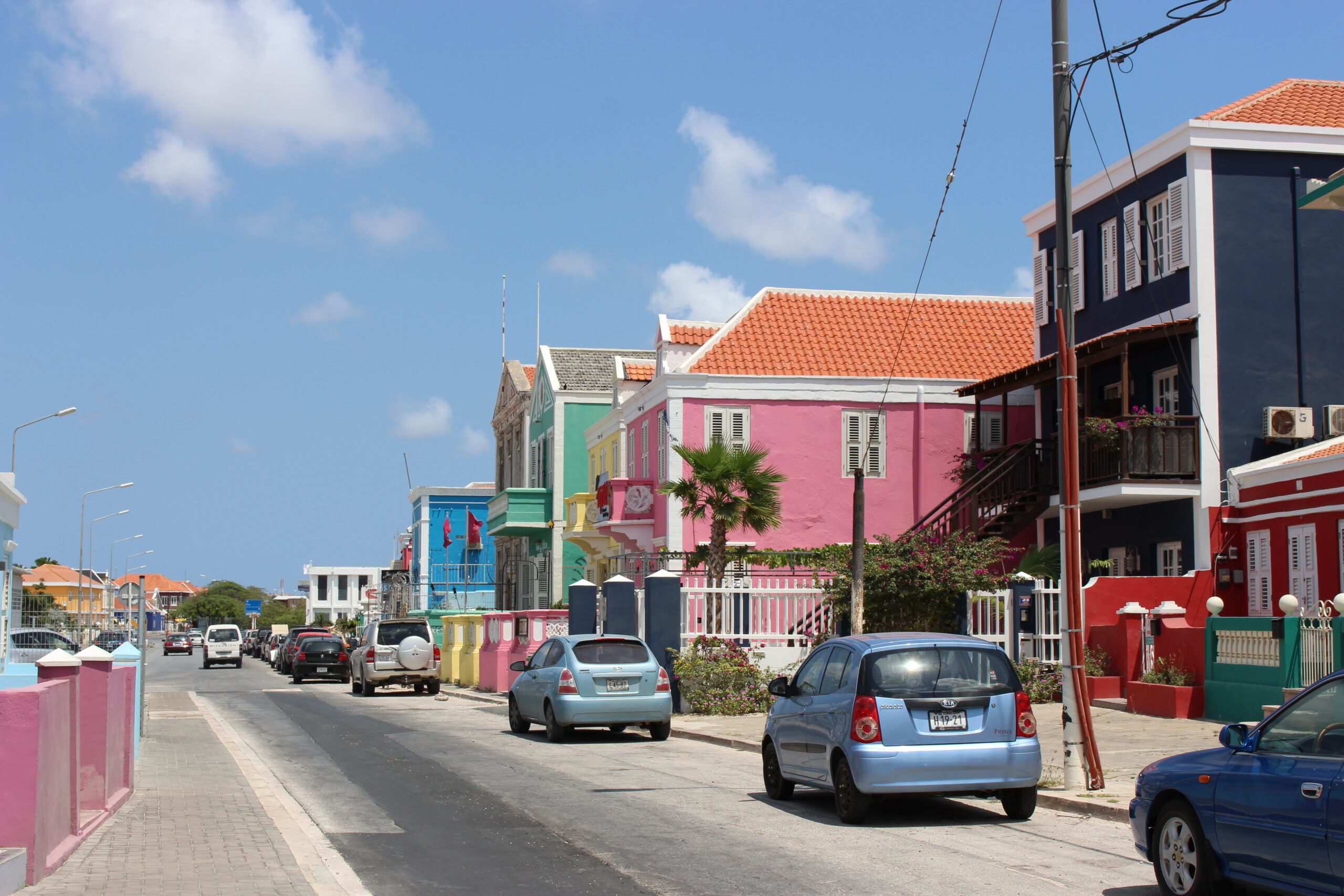 Street view with colourful houses and cars in Pietermaai District, Curaçao