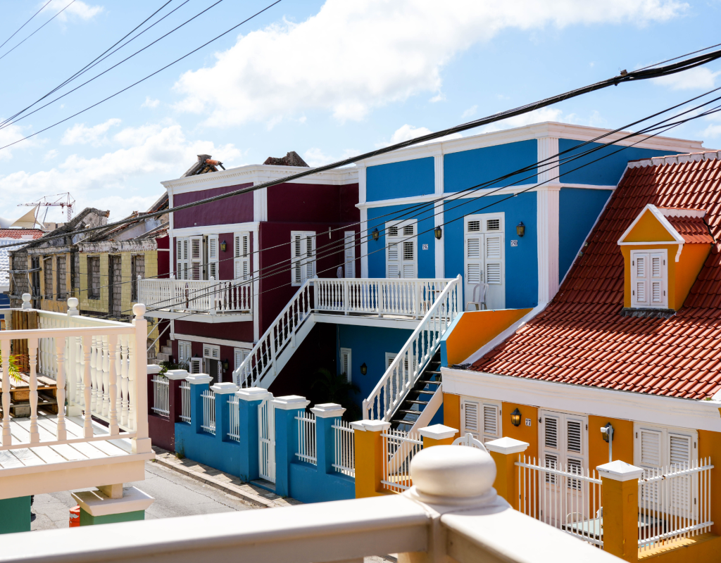 Balcony view of colourful blue Caribbean buildings in Pietermaai – Tierra apartment